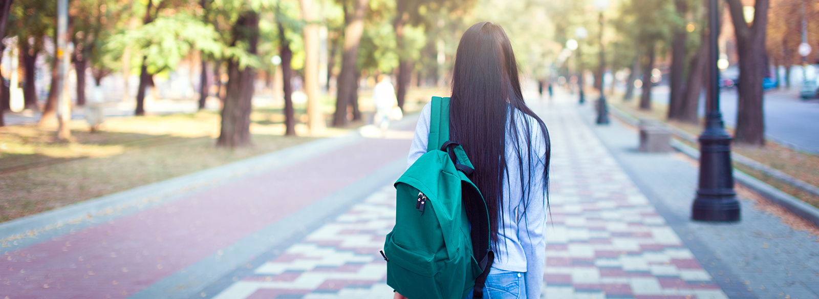 a person walking down a sidewalk